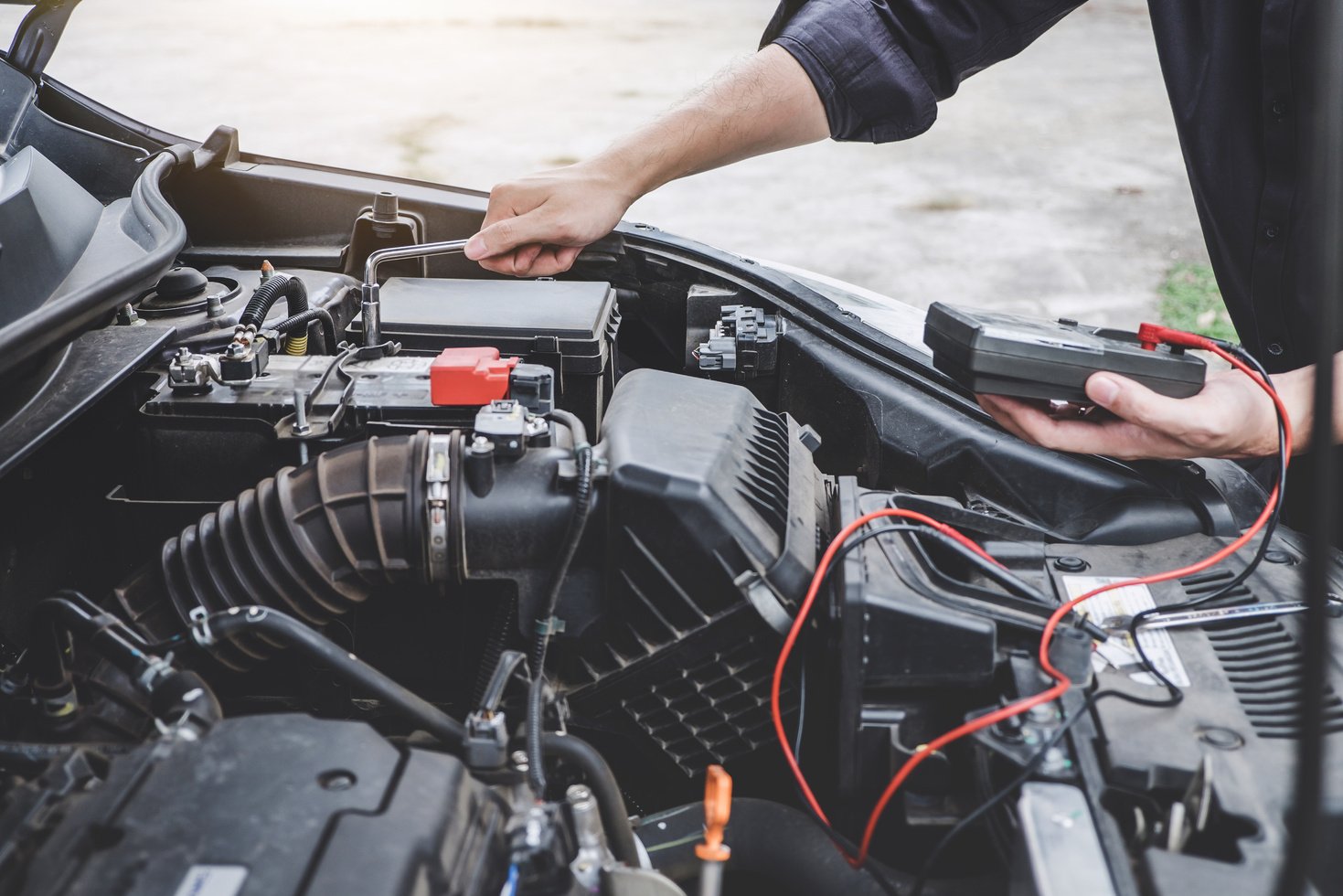 Mechanic Fixing Car Engine